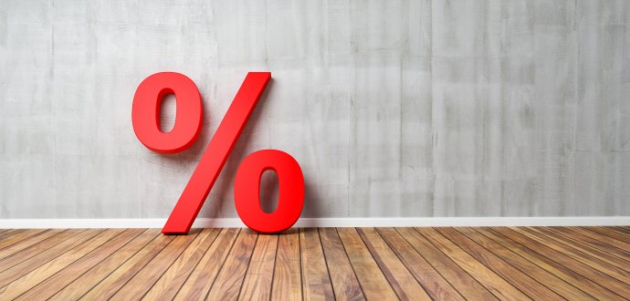 Red Percent Sign on Brown Wooden Floor Against Gray Wall – Sale Concept – 3D Illustration